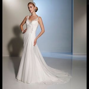 Beautiful beaded wedding dress with illusion back.